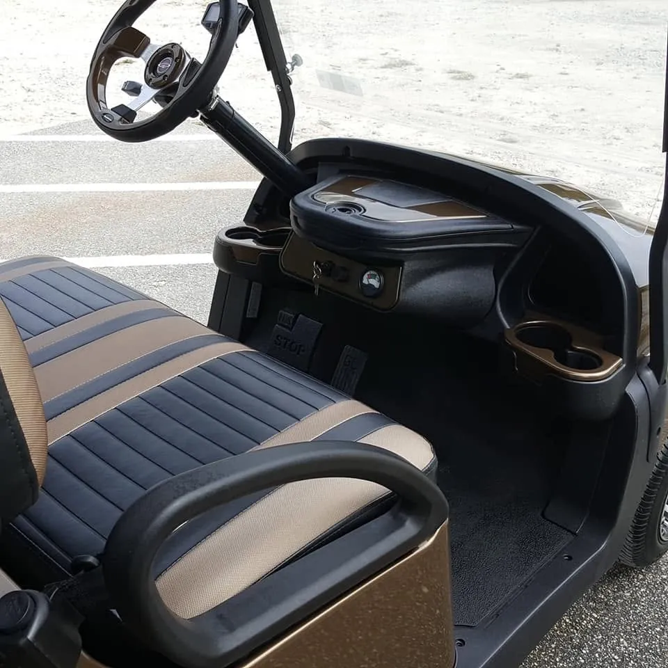 Golf cart interior with custom steering wheel and two-tone bronze seats