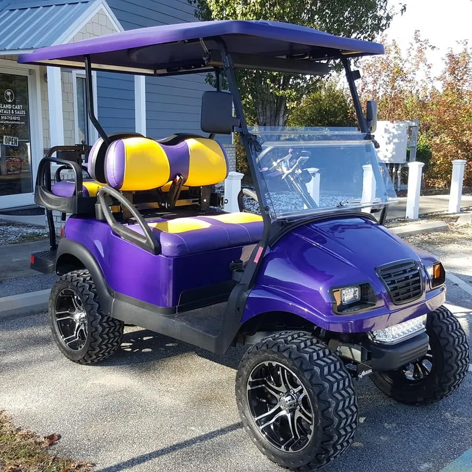 A custom purple lifted Island Cart with purple-and-gold seats and custom wheels, built in Supply, NC
